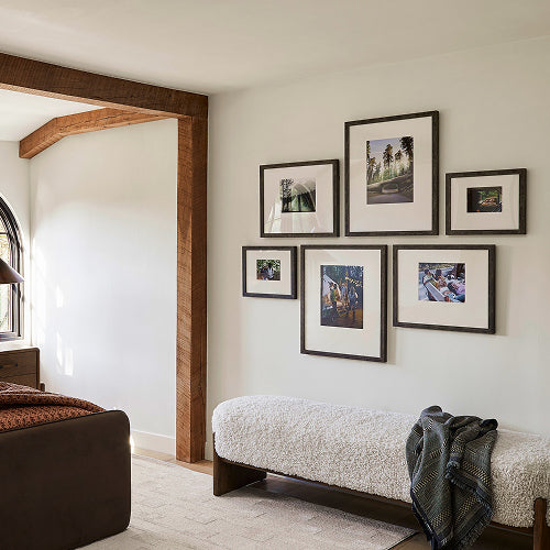 Custom gallery wall in a sunny room Custom gallery wall in a sunny room