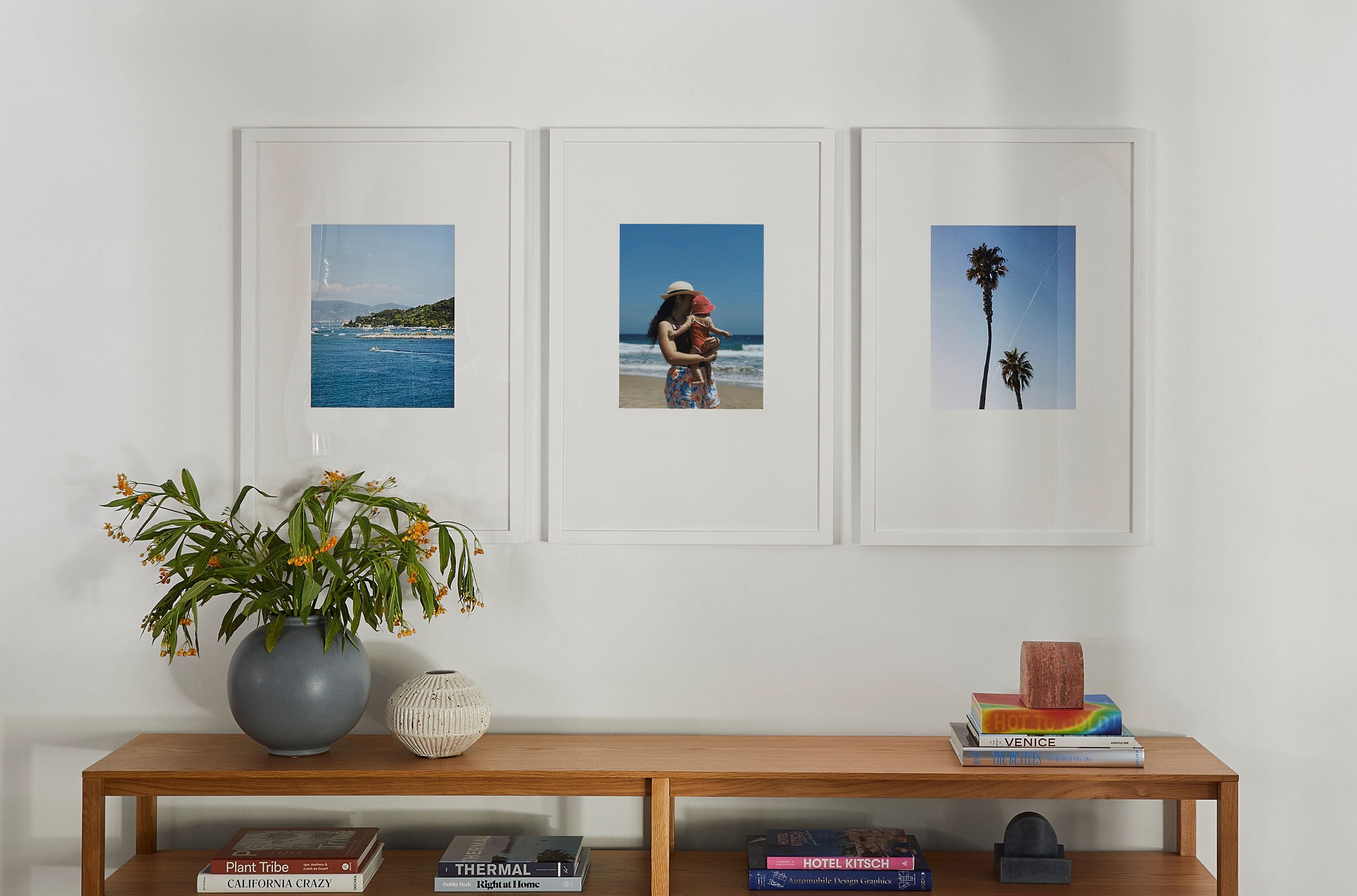 Luxe triptych gallery wall, white matted photos